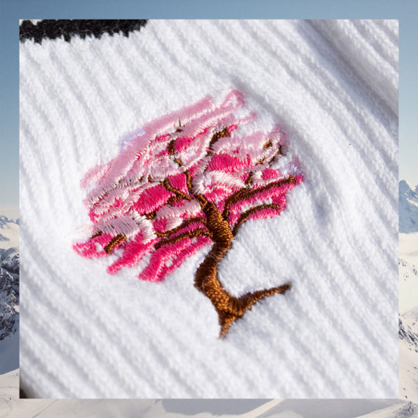 Closeup picture of cherry blossom tree embroidery on socks